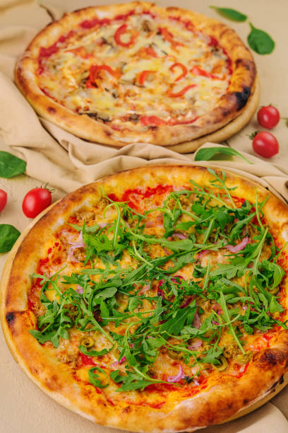 istock pizza with arugula and pizza with cheese and pepper 1768513430