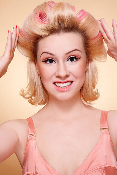 istock Girl in hair-curlers 176851466