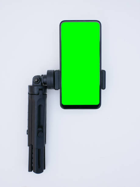 istock smartphone with green screen on portable tripod 1768516771