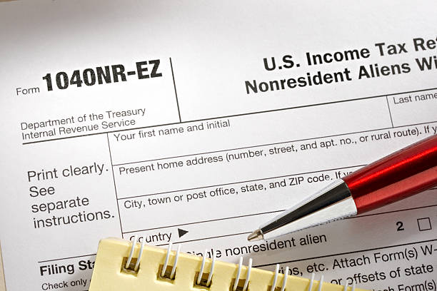 istock Tax form and pen 176851802