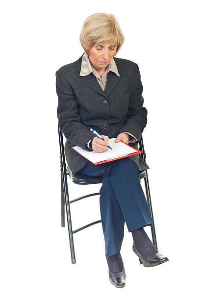 istock Senior businesswoman writing 176852635