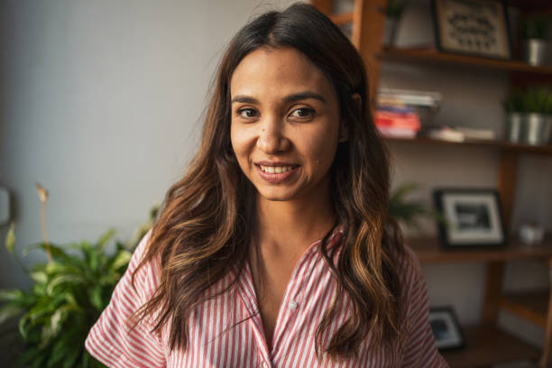 istock Smiling Latin woman looking at the camera 1768526973