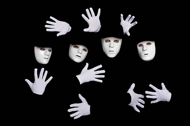 Team of young break dancers in masks Portrait of a team of young break dancers in masks on a black background. mime artist stock pictures, royalty-free photos & images