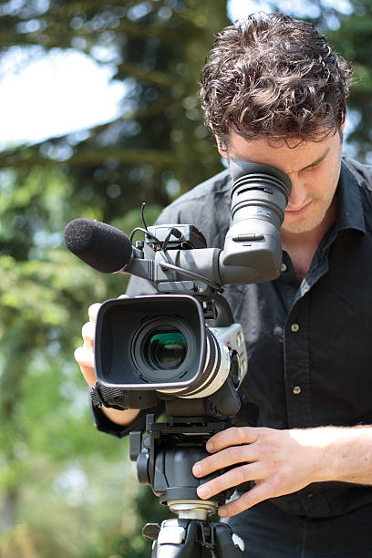 Camera man on the job stock photo