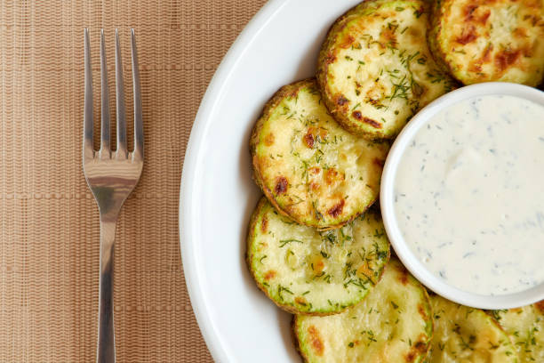 istock Fried sliced zucchini served with yogurt dip. 1768534152