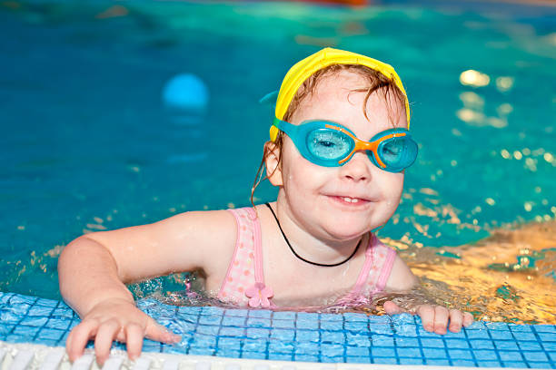 istock Child in a swimming pool 176854624
