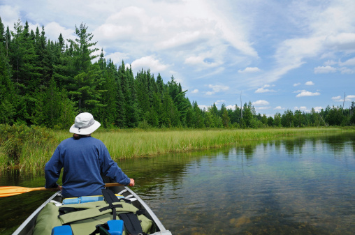 This canoer is heading up the Agnes River in Quetico Provincial Park