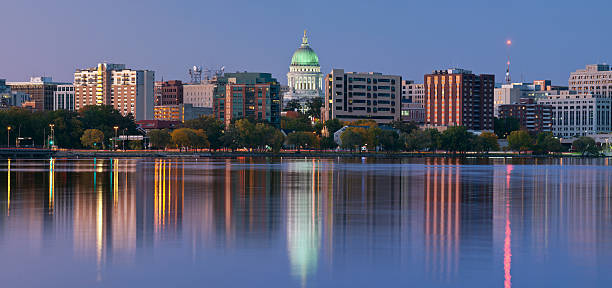 Scenery of Madison with a lake and tall office buildings Panoramic image of Madison (Wisconsin) at twilight. This is stitched composite of 5 vertical images. wisconsin state capitol building stock pictures, royalty-free photos & images