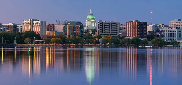 Photo of Scenery of Madison with a lake and tall office buildings
