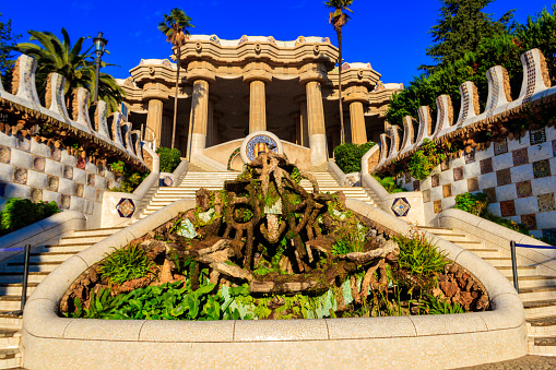 Barcelona, Spain - December 16, 2022: Entrance of Park Guell designed by Antoni Gaudi in Barcelona, Spain