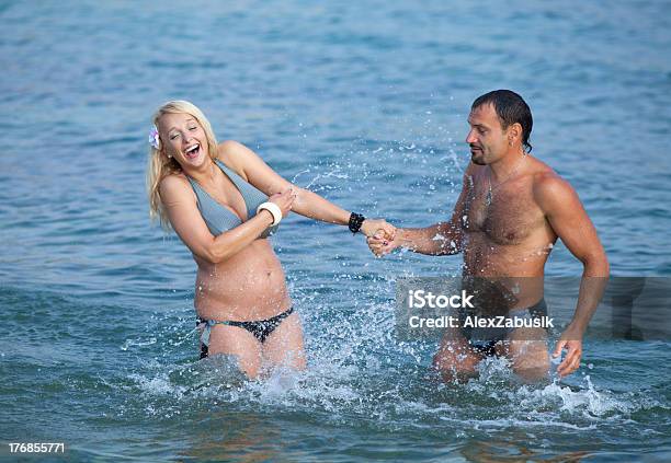 Attractive Couple At The Sea Stock Photo - Download Image Now - 40-44 Years, Couple - Relationship, Pregnant