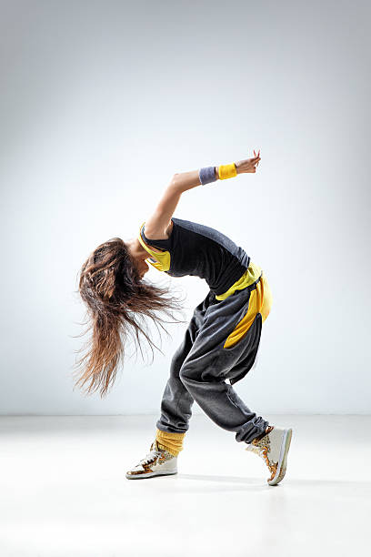 istock Dancer with long hair in black and yellow outfit 176855802