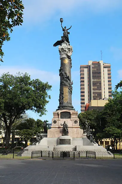 "Statue of Liberty and four founding fathers of the city in the Parque Centenario (Centennial Park) on the Avenida Nueve de Octubre in the center of Guayaquil, Ecuador. Centennial Park is the largest in downtown Guayaquil and commemorates the 100-year anniversary of the 1820 revolution that led to the independence of Ecuador from Spain."
