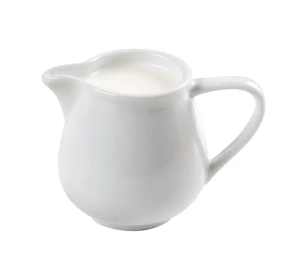 Jug of fresh milk isolated on white background
