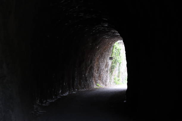 istock View along a disused railway tunnel, on an abandoned train line 1768561265