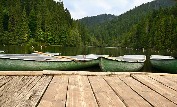 istock Mountain lake with boats 176856681