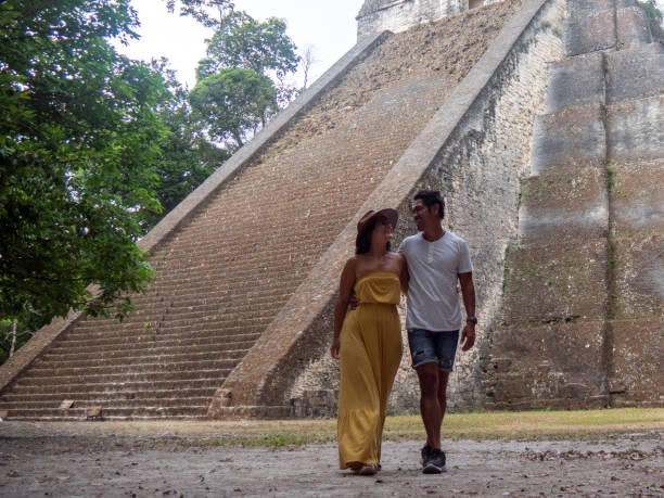 Couple sightseeing the Tikal ruins
