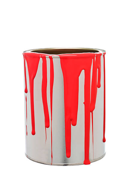 istock Paint can with red paint spilling over sides on white back 176857067
