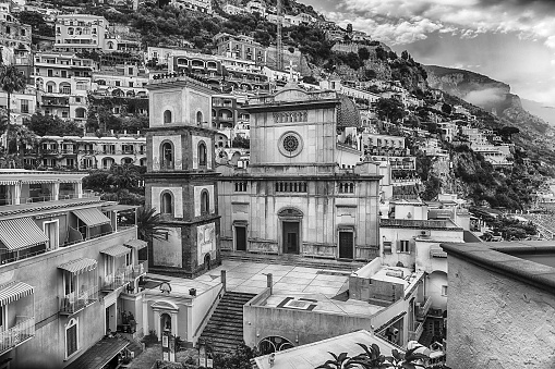 Panoramic view with the facade of the Church of Santa Maria Assunta, iconic landmark in Positano, on the Amalfi Coast of southern Italy