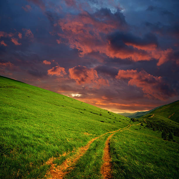 istock hills and road to red clouds 176857106