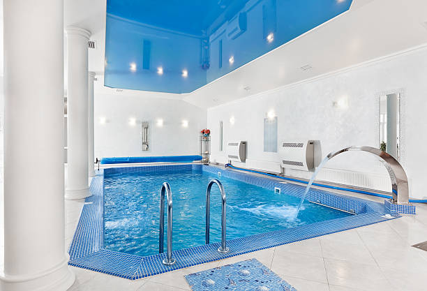 istock Indoor big blue swimming pool interior in modern style 176857208