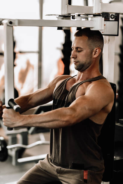 istock Fly Machine Workout For Male Bodybuilder In Gym 1768572672