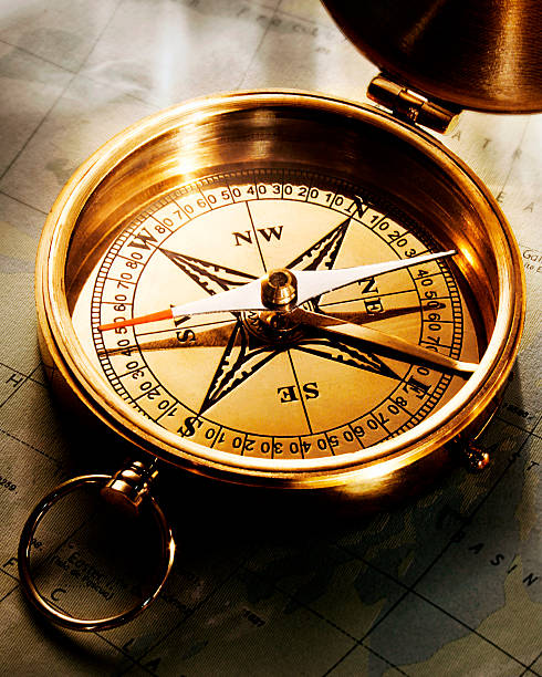 Golden Compass With Direction Arrow Stock Photo - Download Image