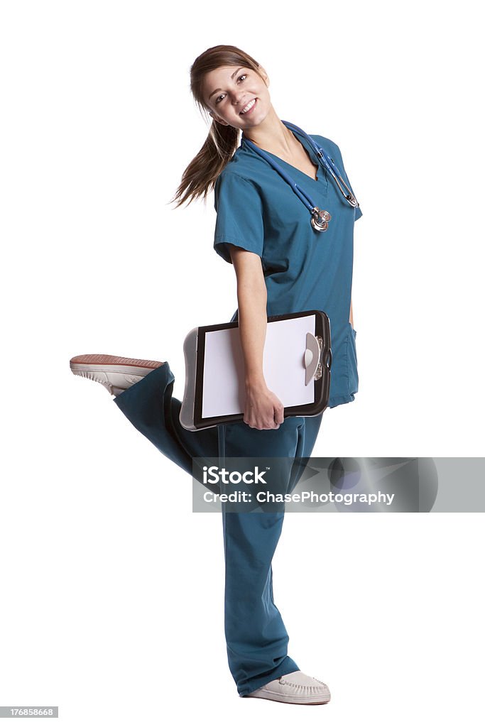 Pie joven linda enfermera viendo posterior - Foto de stock de Enfermera libre de derechos
