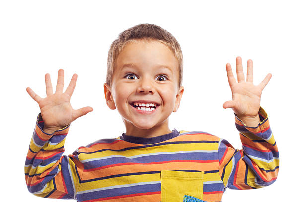 Smiling little children "Funny smiling little children, showing their teeth and hands, isolated on white" smiling kids on white stock pictures, royalty-free photos & images