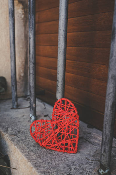 istock Lonely read heart over an iron fence 1768588126