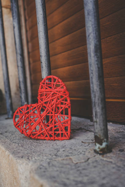istock Lonely read heart over an iron fence 1768588137