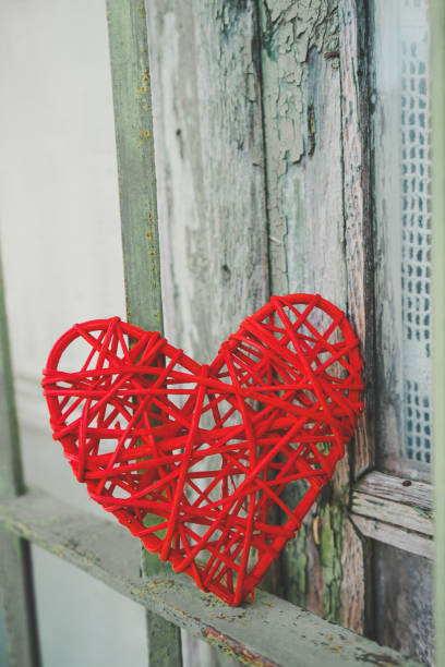 istock Vintage image with a red heart in a green fence 1768588164