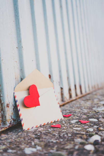 istock Little red hearts inside of an old envelope 1768588166