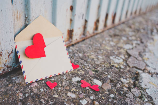 istock Little red hearts inside of an old envelope 1768588184