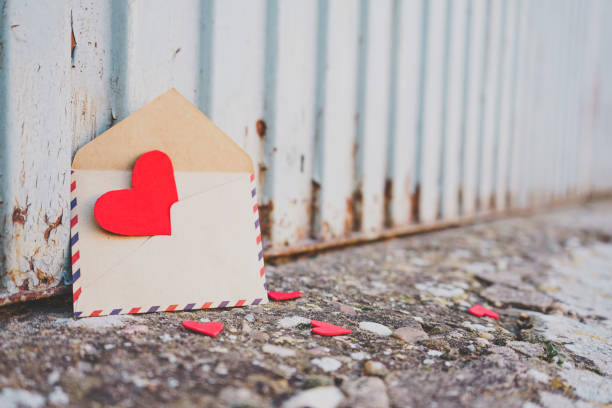 istock Little red hearts inside of an old envelope 1768588185