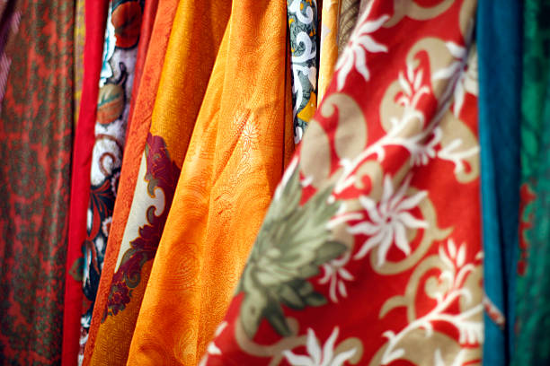 Colorful fabrics sold at an open market stock photo