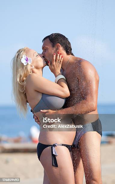 Attractive Couple At The Sea Stock Photo - Download Image Now - Women, 40-44 Years, Bikini