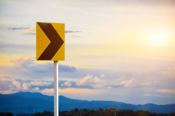 Right narrow curve traffic sign on pole with cloudy and bluesky background
