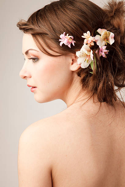 Bridal hairstyle with flowers stock photo