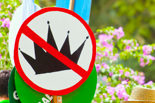 Banner against royalty, Crown . Alameda, public park in Santiago de Compostela, A Coruña province, Galicia, Spain.