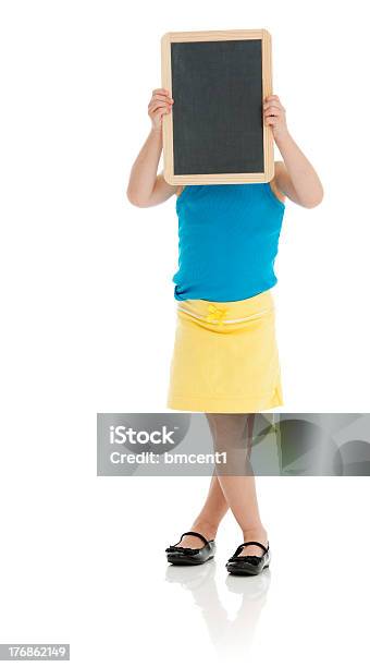 Young Girl Holds Blank Chalk Board Over Face Stock Photo - Download Image Now - 4-5 Years, Blank, Blue