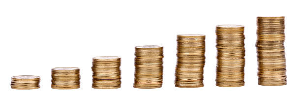 Growing Stacks of Golden Coins "Seven golden coin stacks in an inclining height, representing financial growth. Isolated on white background." israeli coin stock pictures, royalty-free photos & images