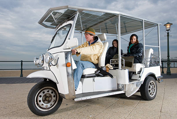 Solar powered tuctuc at the beach stock photo