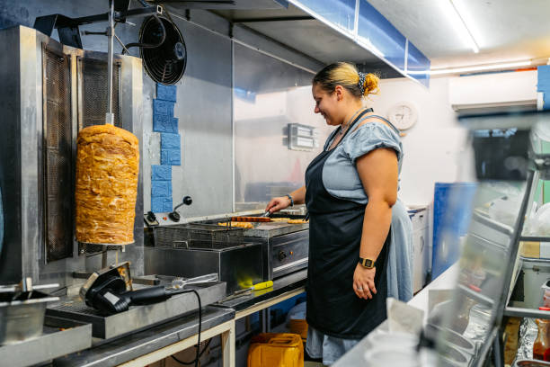 istock Food Service Worker Preparing Gyros At A Diner 1768632645
