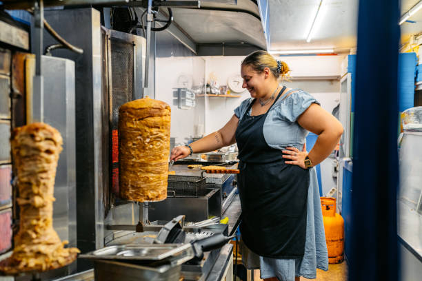 istock Food Service Worker Preparing Gyros At A Diner 1768635468