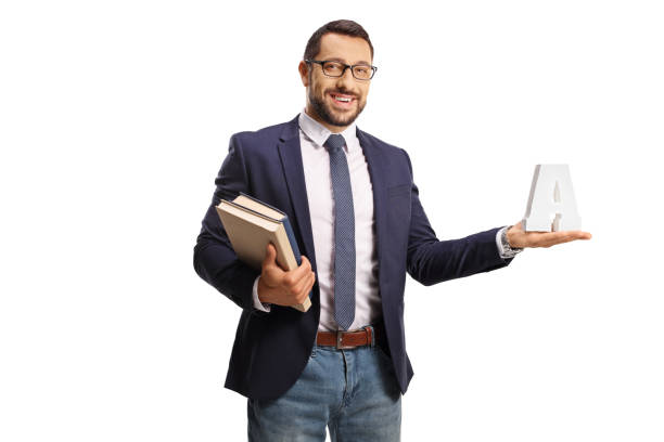 young man with glasses holding books and the letter a - isolated holding letter people imagens e fotografias de stock