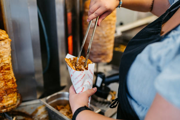 istock Food Service Worker Preparing Gyros At A Diner 1768637181