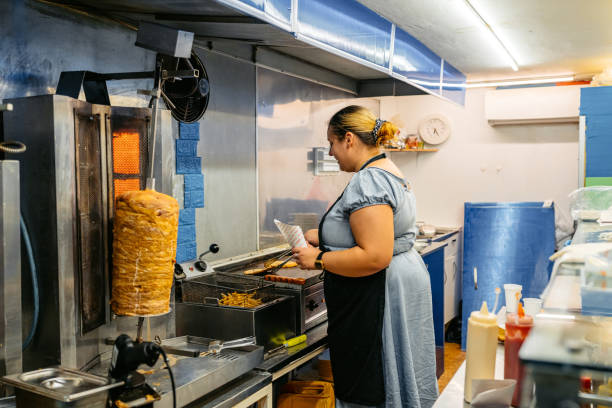 istock Food Service Worker Preparing Gyros At A Diner 1768637813