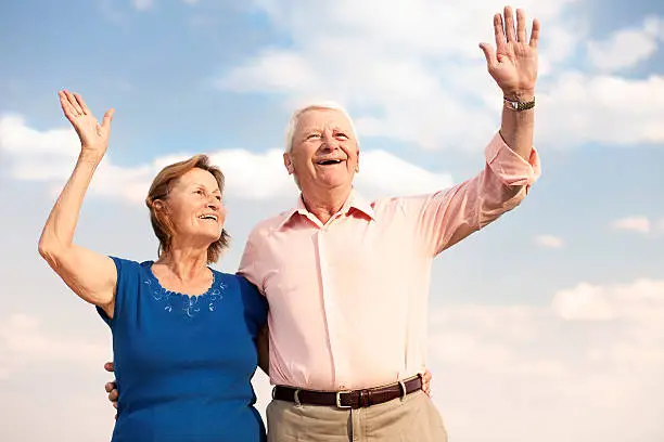 "image of waving happy seniors, taken with a Canon 5D MKII, focal length 85mm at f 4, this image is very clear and sharp"