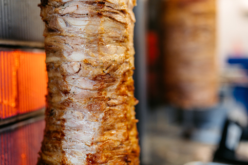 Gyros meat being grilled in a diner.